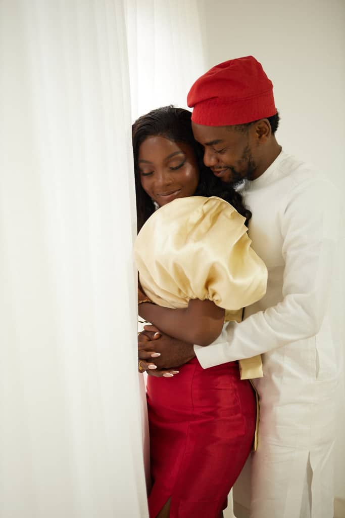Opeyimika and Chima looking at each other as they embrace