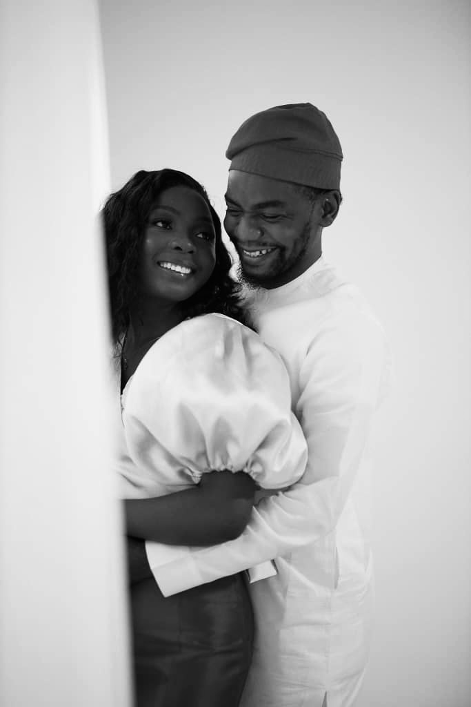 Opeyimika and Chima smiling together in a black and white portrait